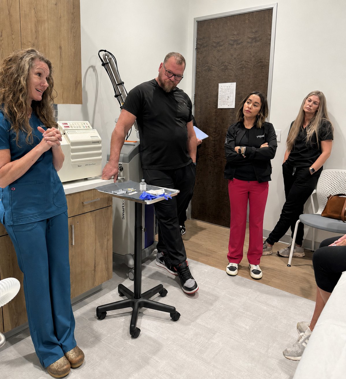 Dr. Suzanne Ferree teaching a group of providers during a clinic case discussion