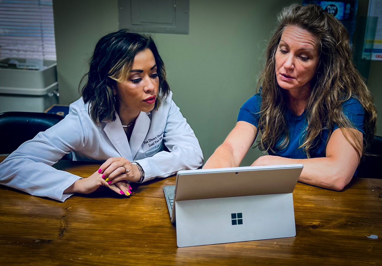 Dr. Suzanne Ferree working with a colleague in practice