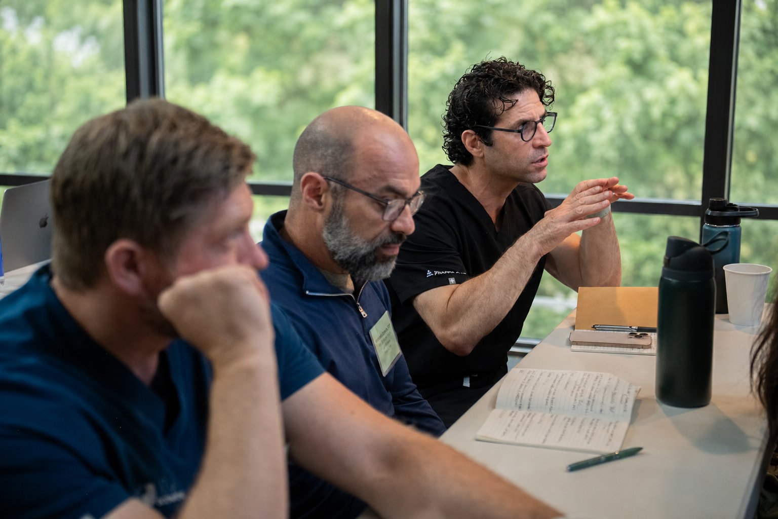 Providers in a small-group discussion during the Neural Therapy Conference